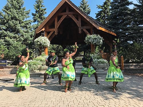 Dancers and drummers with the charity Island Breeze Manitoba perform in a Steinbach after PCs promise to nearly double the charitable donation tax credit if re-elected. (Carol Sanders / Winnipeg Free Press)