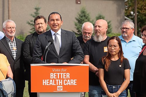 NDP Leader Wab Kinew speaks during an announcement at the East End Community Centre alongside Brandon West candidate Quentin Robinson (left) and Brandon East candidate Glen Simard (second from left) on Friday afternoon. (Tim Smith/The Brandon Sun)