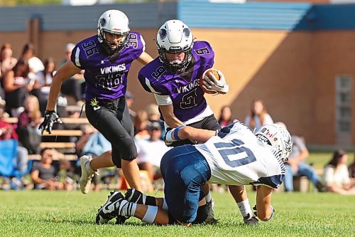 08092023
Kristian Williamson #9 of the Vincent Massey Vikings is tackled by Jesse Deneka #10 of the Grant Park Pirates during high school football action on Friday. (Tim Smith/The Brandon Sun)