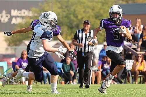 08092023
Kristian Williamson #9 of the Vincent Massey Vikings runs the ball during high school football action against the Grant Park Pirates on Friday. (Tim Smith/The Brandon Sun)