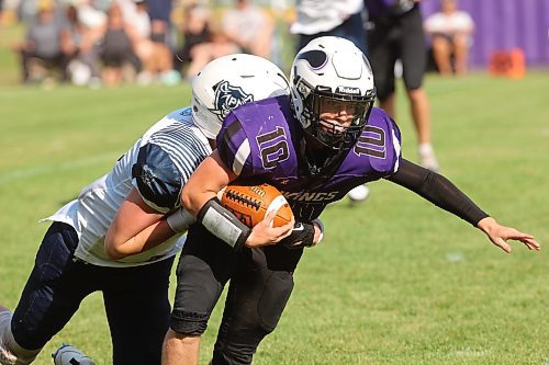 08092023
Quarterback Coleton Malyon of the Vincent Massey Vikings is tackled as he runs the ball during high school football action against the Grant Park Pirates on Friday. (Tim Smith/The Brandon Sun)