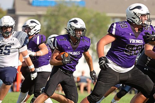 08092023
Logan Van Santen #7 of the Vincent Massey Vikings runs the ball during high school football action against the Grant Park Pirates on Friday. (Tim Smith/The Brandon Sun)