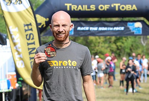 Steffan Reimer from Blumenort poses with his medal near the finish line after winning the 50-kilometre event in record-setting fashion at Race The North Face Brandon Hills on Saturday. (Perry Bergson/The Brandon Sun)
Sept. 9, 2023