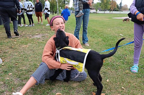 Lola Norosky plays with Rio during the Brandon Humane Society’s 20th Wag-A-Tail Walk-A-Thon, which began at Kin Park on Sunday morning. Rio is just one of the many dogs that are currently up for adoption through the Humane Society. (Kyle Darbyson/The Brandon Sun)