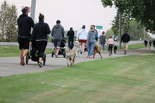 Local dog owners leave Kin Park Sunday morning during this year’s Wag-A-Tail Walk-A-Thon, which serves as an essential fundraising event for the Brandon Humane Society.  (Kyle Darbyson/The Brandon Sun)