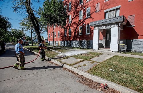 JOHN WOODS / WINNIPEG FREE PRESS
Firefighters wash blood off the street outside 285 College in Winnipeg Monday, September 11, 2023. Winnipeg&#x573; latest murder occurred at this North End location 

Reporter: eric