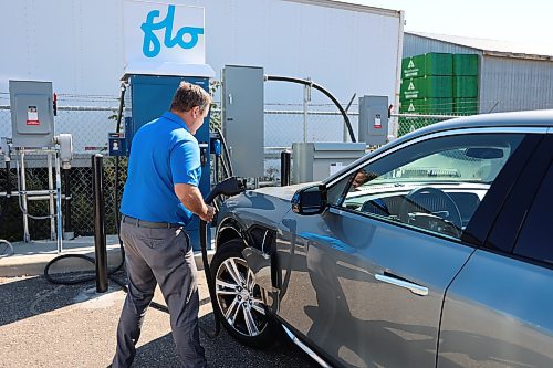 Murray Chevrolet Cadillac Buick GMC Brandon Dealer Principal Rich Pentney charging EV model of Cadillac Lyriq. (Abiola Odutola/The Brandon Sun)