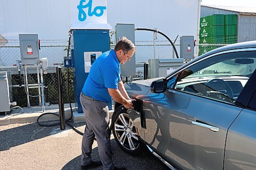 Murray Chevrolet Cadillac Buick GMC Brandon Dealer Principal Rich Pentney charging EV model of Cadillac Lyriq. (Abiola Odutola/The Brandon Sun)