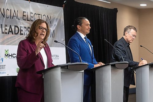 MIKE DEAL / WINNIPEG FREE PRESS
Premier Heather Stefanson (PC), Opposition Leader Wab Kinew (NDP) and Liberal Leader Dougald Lamont take part in the Manitoba Heavy Construction Association&#x2019;s Party Leaders Forum at the Holiday Inn Express, 1740 Ellice Avenue, early Tuesday morning.
See Gabby Piche story
230912 - Tuesday, September 12, 2023.