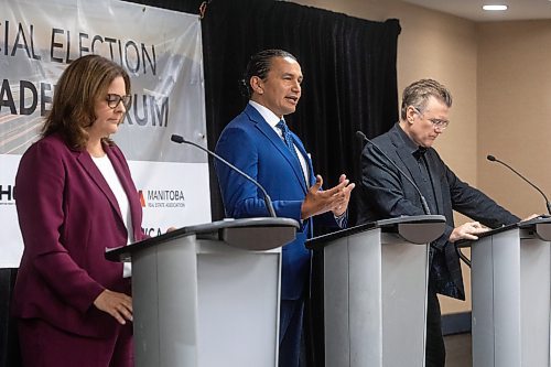 MIKE DEAL / WINNIPEG FREE PRESS
Premier Heather Stefanson (PC), Opposition Leader Wab Kinew (NDP) and Liberal Leader Dougald Lamont take part in the Manitoba Heavy Construction Association&#x2019;s Party Leaders Forum at the Holiday Inn Express, 1740 Ellice Avenue, early Tuesday morning.
See Gabby Piche story
230912 - Tuesday, September 12, 2023.