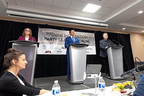 MIKE DEAL / WINNIPEG FREE PRESS
Premier Heather Stefanson (PC), Opposition Leader Wab Kinew (NDP) and Liberal Leader Dougald Lamont take part in the Manitoba Heavy Construction Association&#x2019;s Party Leaders Forum at the Holiday Inn Express, 1740 Ellice Avenue, early Tuesday morning.
See Gabby Piche story
230912 - Tuesday, September 12, 2023.