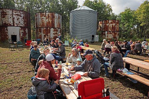 Families from Westman and eastern Saskatchewan attended the annual Crossborders Community Growing Project harvest lunch in a field near Kola, Manitoba on Sept. 11. Due to overnight rain, the planned harvest of 267 acres of canola had to be postponed but the community still held their picnic. When the canola is harvested, the proceeds from the sale of the canola will benefit the Canadian Foodgrains Bank, which provides food assistance in areas in need around the world, as well as local organizations in Westman and eastern Saskatchewan. (Tim Smith/The Brandon Sun)