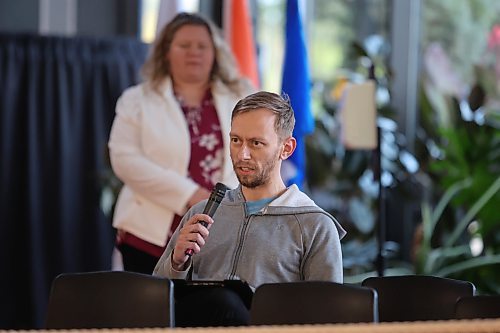 Resident Aaron Olson asks a question during a public hearing on the City of Brandon's requested water rate increases at Brandon City Hall on Wednesday evening. (Colin Slark/The Brandon Sun)
