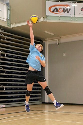 Kale Fisher attacks during Brandon University Bobcats men's volleyball practice on Wednesday. (Thomas Friesen/The Brandon Sun)