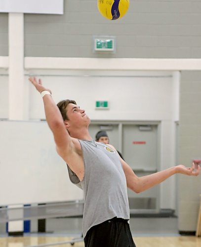 Noah Rigney serves during Brandon University Bobcats men's volleyball practice on Wednesday. (Thomas Friesen/The Brandon Sun)