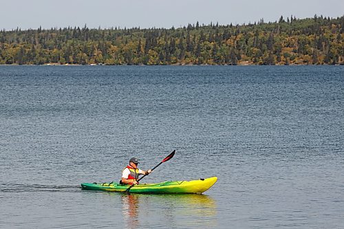 13092023
A kayaker paddles through the water of Clear Lake on a beautiful Wednesday at Riding Mountain National Park.
(Tim Smith/The Brandon Sun)

