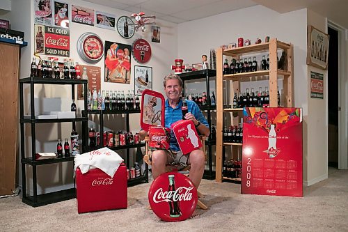 BROOK JONES / WINNIPEG FREE PRESS
Winnipegger Morris Glimcher, who was the executive director of the Manitoba High Schools Athletic Association from 1975 to 2016, shows off his Coca-Cola collection of bottles and memorabilia at his home in Winnipeg, Man., Wednesday, Sept. 13, 2023. Glimcher is often referred to by his nickname Mo.
