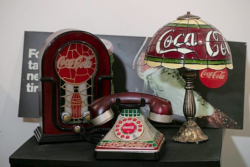 BROOK JONES / WINNIPEG FREE PRESS
Winnipeg resident Morris Glimcher, who was the executive director of the Manitoba High Schools Athletic Association from 1975 to 2016, shows off his Coca-Cola collection of bottles and memorabilia, including a vintage Tiffany style Coca-Cola lamp, Coca-Cola vintage radio and a Coca-Cola stained glass appearance light up push button telephone, in his rec room at his home in Winnipeg, Man., Wednesday, Sept. 13, 2023. Glimcher has been collecting Coca-Cola memorabilia for 20 years. His love for Coca-Cola goes back to when he was a kid and stocked his parent's North End corner storie with the world famous drink. 