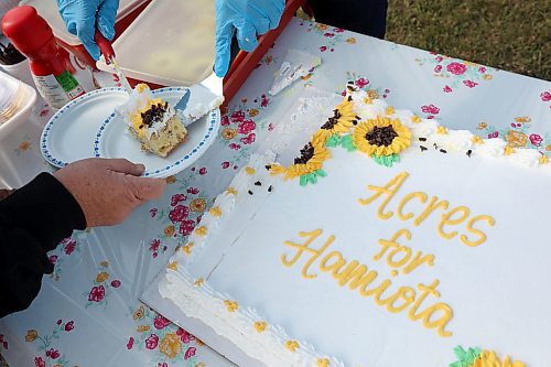 14092023
Cake is served during a BBQ lunch at the third annual Acres for Hamiota harvest west of Hamiota on warm Thursday. Acres for Hamiota raises money for community projects and organizations.  (Tim Smith/The Brandon Sun)