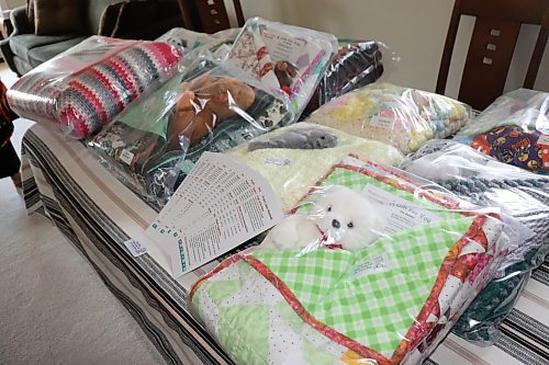 A closer look at some of the handmade blankets that Project Linus Westman co-ordinator Trish Parobec was storing at her Brandon residence on Aug. 8. The mission statement of Project Linus, which has 45 chapters across Canada, is to provide comfort to children through the creation and distribution of these handmade blankets. (Kyle Darbyson/The Brandon Sun) 