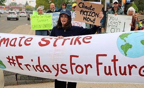 Anna Ramsey leads the chant of, "Cap the gas, cap the oil, keep the carbon in the soil" during the Global Climate Strike event's stop at city hall in Brandon on Friday. (Photos by Michele McDougall/The Brandon Sun)
