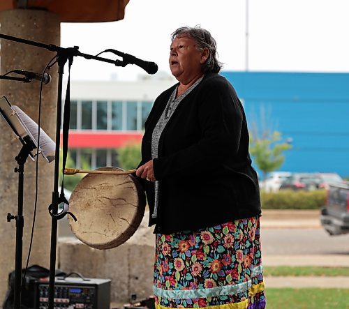  Debbie Huntinghawk, knowledge-keeper, sings a water song to the participants of the Global Climate Strike event in Brandon's Princess Park on Friday. (Michele McDougall/The Brandon Sun)