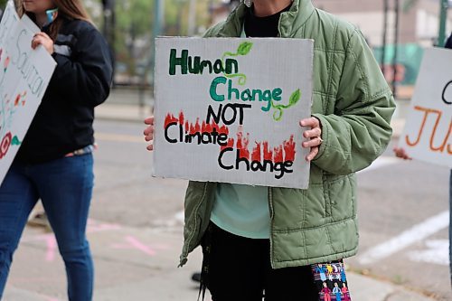 A sign that stated, "Human change not climate change" seen during the Global Climate Strike event in Brandon on Friday. (Michele McDougall/The Brandon Sun)
