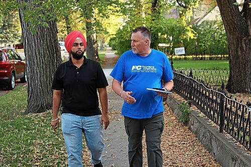 Brandon East Progressive Conservative candidate Len Isleifson goes door-knocking along with volunteer Ajay Dhindsa on 16th Street in Brandon to introduce himself to voters on Thursday evening. (Tim Smith/The Brandon Sun)