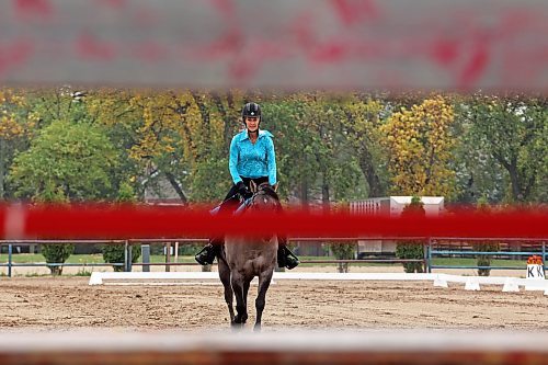 15092023
Jacquie Doyle rides A Tiny Cinder (Cindy) during her western dressage test at the Westman Dressage Fall Festival at the Keystone Centre grounds on Friday. The Fall Festival runs until Sunday. (Tim Smith/The Brandon Sun)