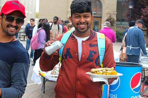 Members of the Brandon University community enjoy a free meal at Kavanagh Courtyard on Friday afternoon during the school’s inaugural langar event. (Kyle Darbyson/The Brandon Sun)