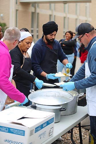 Brandon University officials and members of the local Sikh community serve up some free food Friday afternoon on campus during the school’s first-ever langar event. (Kyle Darbyson/The Brandon Sun)