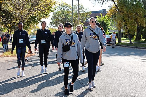 Members of the Brandon University women’s volleyball team walk down Louise Avenue during the beginning of Sunday’s local Terry Fox Run. This year’s charity run attracted around 120 participants and raised over $12,000 to fund cancer research. (Kyle Darbyson/The Brandon Sun)