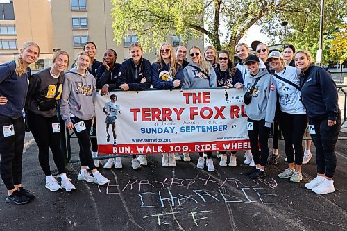 Members of the Brandon University women’s volleyball team pose for a group photo at the starting line for Sunday’s Terry Fox run, which began and ended on campus. (Kyle Darbyson/The Brandon Sun)