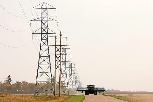 19092023
Combines make their way along a grid road northeast of Brandon on a hot Monday afternoon. (Tim Smith/The Brandon Sun)