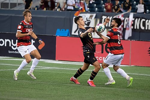 BROOK JONES / WINNIPEG FREE PRESS
Valour FC played to a 1-0 loss against Vancouver FC in Canadian Premier League action at IG Field in Winnipeg, Man., Wednesday, Sept 20, 2023. Pictured: Valour FC midfielder Walter Benjamin Ponce Gallardo and Vancouver FC attacker Gabriel Bitar fight for the soccer ball during first half play.