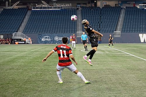 BROOK JONES / WINNIPEG FREE PRESS
Valour FC played to a 1-0 loss against Vancouver FC in Canadian Premier League action at IG Field in Winnipeg, Man., Wednesday, Sept 20, 2023. Pictured: Valour FC midfielder jumps to head the soccer ball against Vancouver FC during first half play. 