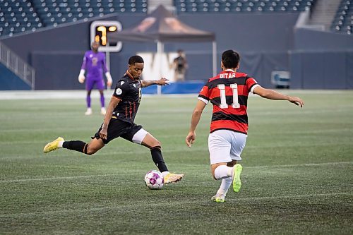 BROOK JONES / WINNIPEG FREE PRESS
Valour FC played to a 1-0 loss against Vancouver FC in Candian Premier League action at IG Field in Winnipeg, Man., Wednesday, Sept 20, 2023. Pictured: Valour FC midfielder Dante Campbell kicks the soccer ball as Vancouver FC attacker Gabriel Bitar approaches during first half play. 