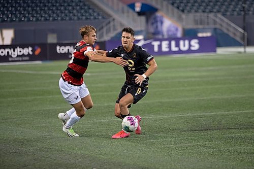BROOK JONES / WINNIPEG FREE PRESS
Valour FC played to a 1-0 loss against Vancouver FC in Canadian Premier League action at IG Field in Winnipeg, Man., Wednesday, Sept 20, 2023. Pictured: Valour FC midfielder Walter Benjamin Ponce Gallardo fights for the soccer ball against Vancouver FC midfielder James Cameron during first half play. 