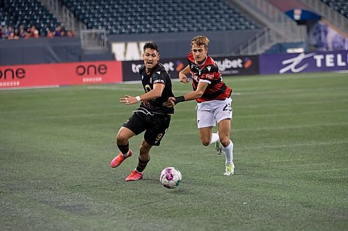 BROOK JONES / WINNIPEG FREE PRESS
Valour FC played to a 1-0 loss against Vancouver FC in Canadian Premier League action at IG Field in Winnipeg, Man., Wednesday, Sept 20, 2023. Pictured: Valour FC midfielder Walter Benjamin Ponce Gallardo fights for the soccer ball against Vancouver FC midfielder James Cameron during first half play.