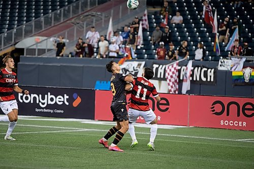 BROOK JONES / WINNIPEG FREE PRESS
Valour FC played to a 1-0 loss against Vancouver FC in Canadian Premier League action at IG Field in Winnipeg, Man., Wednesday, Sept 20, 2023. Pictured: Valour FC midfielder Walter Benjamin Ponce Gallardo and Vancouver FC attacker Gabriel Bitar look up at the soccer ball during first half play.