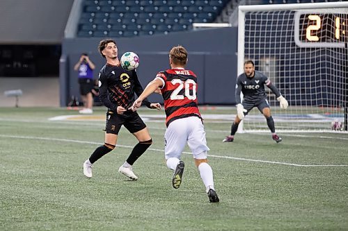 BROOK JONES / WINNIPEG FREE PRESS
Valour FC played to a 1-0 loss against Vancouver FC in Canadian Premier League action at IG Field in Winnipeg, Man., Wednesday, Sept 20, 2023. Pictured: Valour FC midfielder KIan Paul James Williams chests the soccer ball as Vancouver FC defender Anthony White chases down the soccer during first half play.