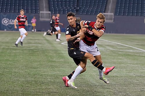 BROOK JONES / WINNIPEG FREE PRESS
Valour FC played to a 1-0 loss against Vancouver FC in Canadian Premier League action at IG Field in Winnipeg, Man., Wednesday, Sept 20, 2023. Pictured: Valour FC attacker Walter Benjamin Ponce Gallardo and Vancouver FC midfielder James Cameron collide after fighting for the soccer ball during first half play.