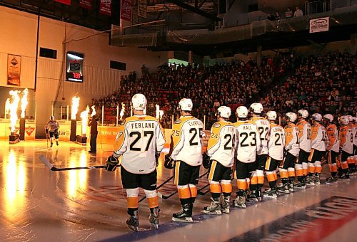 Brandon Sun 25092009 The Brandon Wheat Kings take to the ice amid pyrotechnics prior to the first period of their home-opener against the Swift Current Broncos at Westman Place in Brandon on Friday, September 25, 2009. (Tim Smith/Brandon Sun)