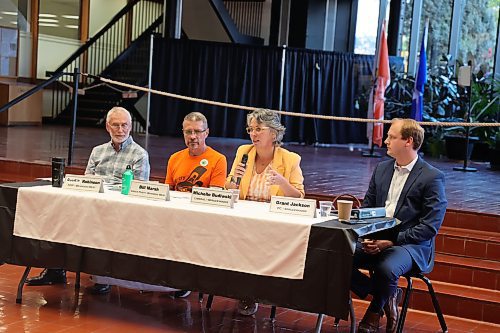 Spruce Woods Liberal candidate Michelle Budiwski (second from right) introduces herself at a town hall held by the Community Wellness Collaborative on Thursday evening at Brandon City Hall as Spruce Woods Progressive Conservative candidate Grant Jackson (right), Brandon West Green Party candidate Bill Marsh (second from left) and Brandon West NDP candidate Quentin Robinson (left) look on. (Colin Slark/The Brandon Sun)
