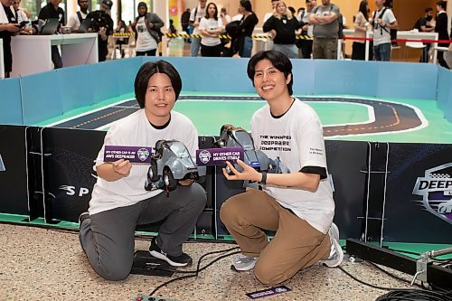 BROOK JONES / WINNIPEG FREE PRESS
Red River College Polytchnic and Amazon Web Services host the 2023 DEEPRACER League competition at Manitou A Bi Bii Daziigae in Winnipeg, Man., Thursday, Sept. 21, 2023. PIctured: Business information technology students Cholong Pak, 37, (left) and her partner Sam Lee, 40.