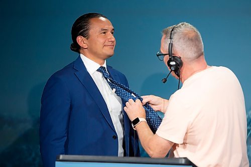 BROOK JONES / WINNIPEG FREE PRESS
CBC employee Jeff Stapleton (right) attaches a clip mic to the tie of Manitoba NDP Party Leader Wab Kinew moments before the start of the Manitoba Leaders' Debate hosted by CBC, CTV News and Gloobal News at CBC's Studio 41 in Winnipeg, Man., Thursday, Sept. 21, 2023. Manitobans head to the polls in the Manitoba Provincial Election Tuesday, Oct. 3, 2023. 