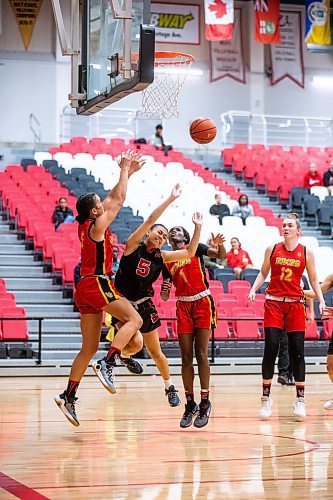 MIKAELA MACKENZIE / WINNIPEG FREE PRESS

Wesmen Alyssa Doneza (5) makes a shot while getting blocked by Dinos players during an inter squad basketball game at the Duckworth Centre on Friday, Sept. 22, 2023. For Taylor Allen story.
Winnipeg Free Press 2023