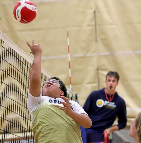 Meegwan Little of the Carberry Cougars dumps the ball during the Brandon University varsity boys' volleyball tournament at Henry Champ Gymnasium on Friday. The 24-team tournament shifts to playoff action at the Healthy Living Centre today. (Thomas Friesen/The Brandon Sun)