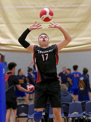 Major Pratt Trojans' Vadym Pertsatii sets during the Brandon University varsity boys' volleyball tournament at Henry Champ Gymnasium on Friday. The Ukrainian, who moved to Russell in February, has quickly established himself as one of the best AA setters in the province. (Thomas Friesen/The Brandon Sun)