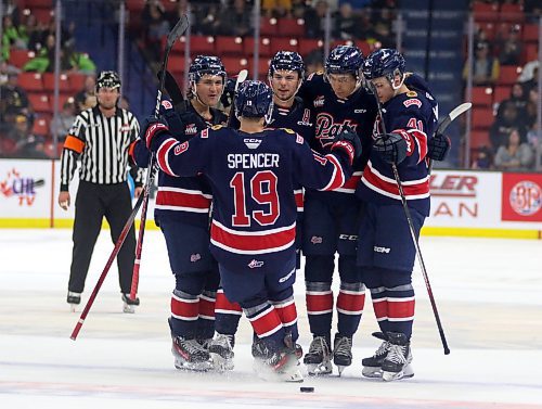 The Regina Pats celebrate Tye Spencer's goal against the Brandon Wheat Kings in their Western Hockey League opener at Westoba Place on Friday. (Thomas Friesen/The Brandon Sun)